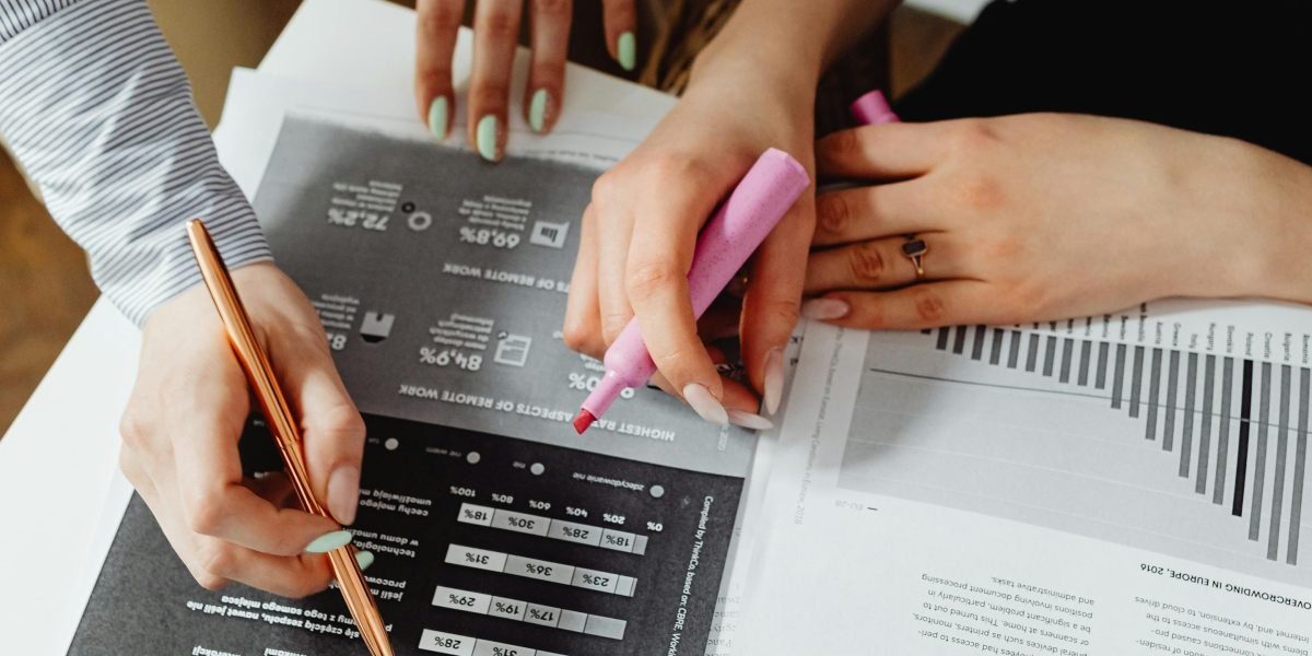 A team collaboratively reviewing documents in a meeting, demonstrating the human-in-the-loop process for validating AI-generated content.