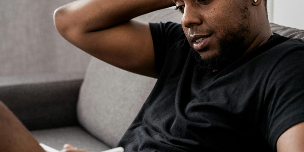 A person looking confused or frustrated while reviewing information, symbolizing the challenge of trusting AI outputs.