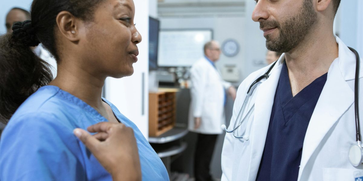 A medical team in a serious discussion, representing the high-stakes consequences of AI hallucinations in healthcare and other critical fields.