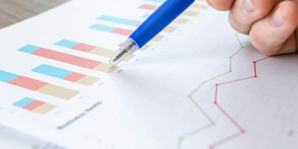 Professionals reviewing charts and data to measure the impact and ROI of quality improvements.