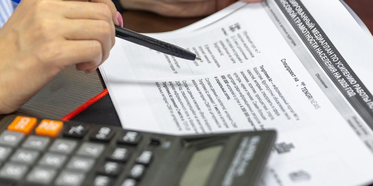 A person diligently reviews documents and charts, representing the meticulous process of data preparation and validation in AI projects.