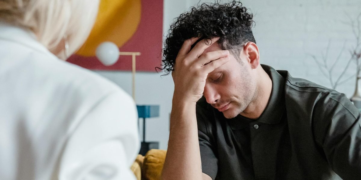 A person intently considering complex problems, symbolizing the search for reliable AI solutions.