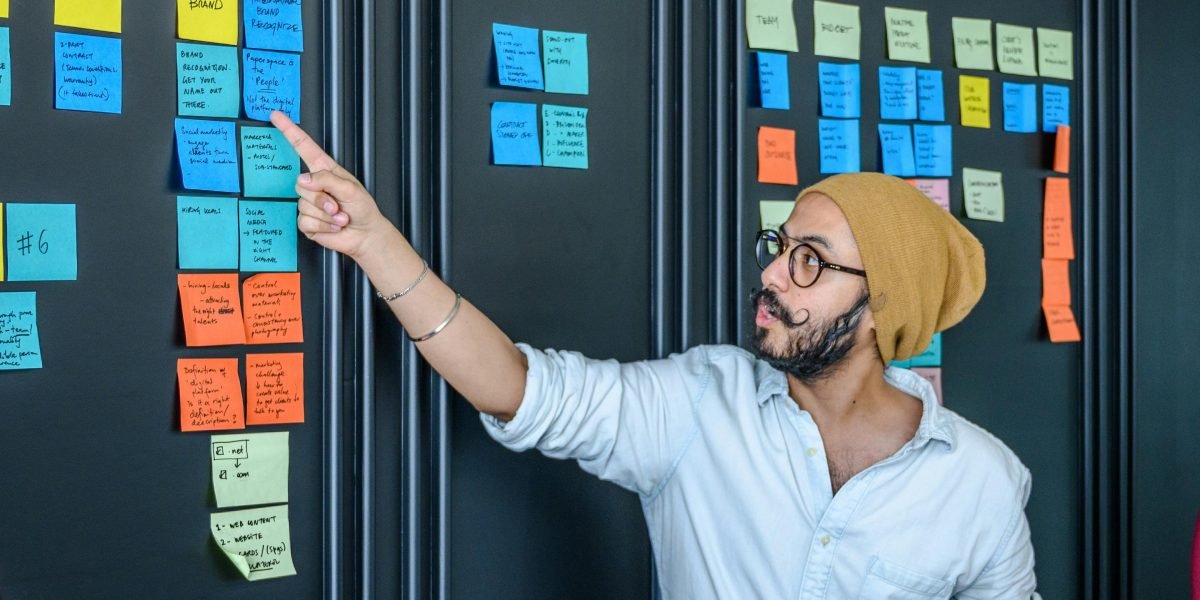A team actively engaged in a brainstorming session, reflecting the need for innovative approaches beyond traditional methods.