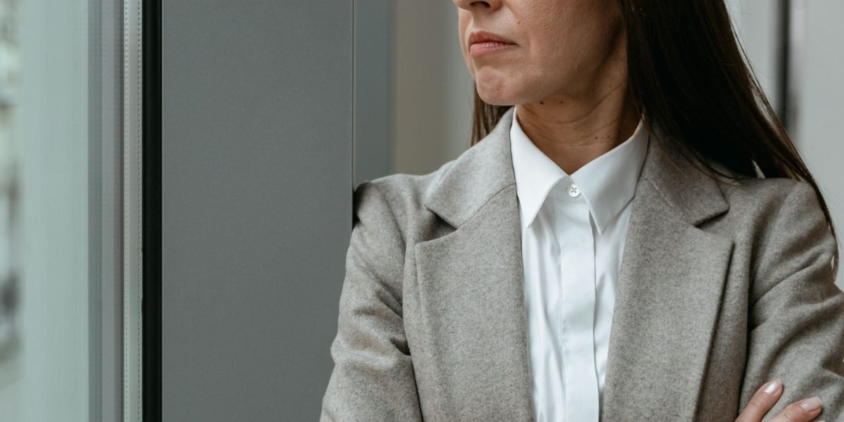 An executive looking thoughtfully, representing the serious real-world risks associated with AI errors.
