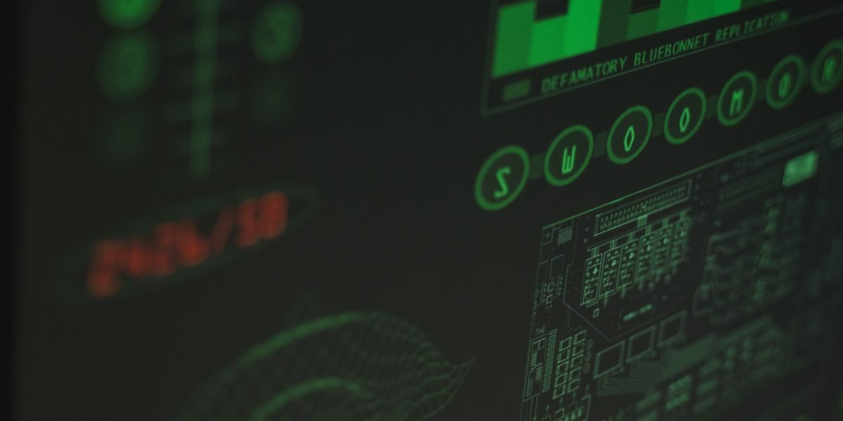 A team actively observes data on multiple screens, symbolizing the continuous monitoring and observability practices crucial for production ML systems.