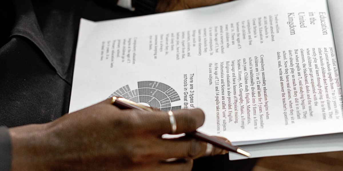 A concerned business professional reviews a document, reflecting the inherent risks of compounded AI hallucinations.