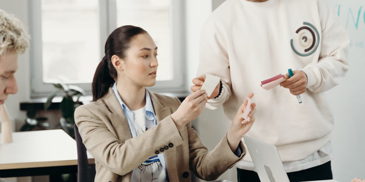 A team collaborates to discuss ethical considerations and decision-making challenges in the context of AI-assisted data management.