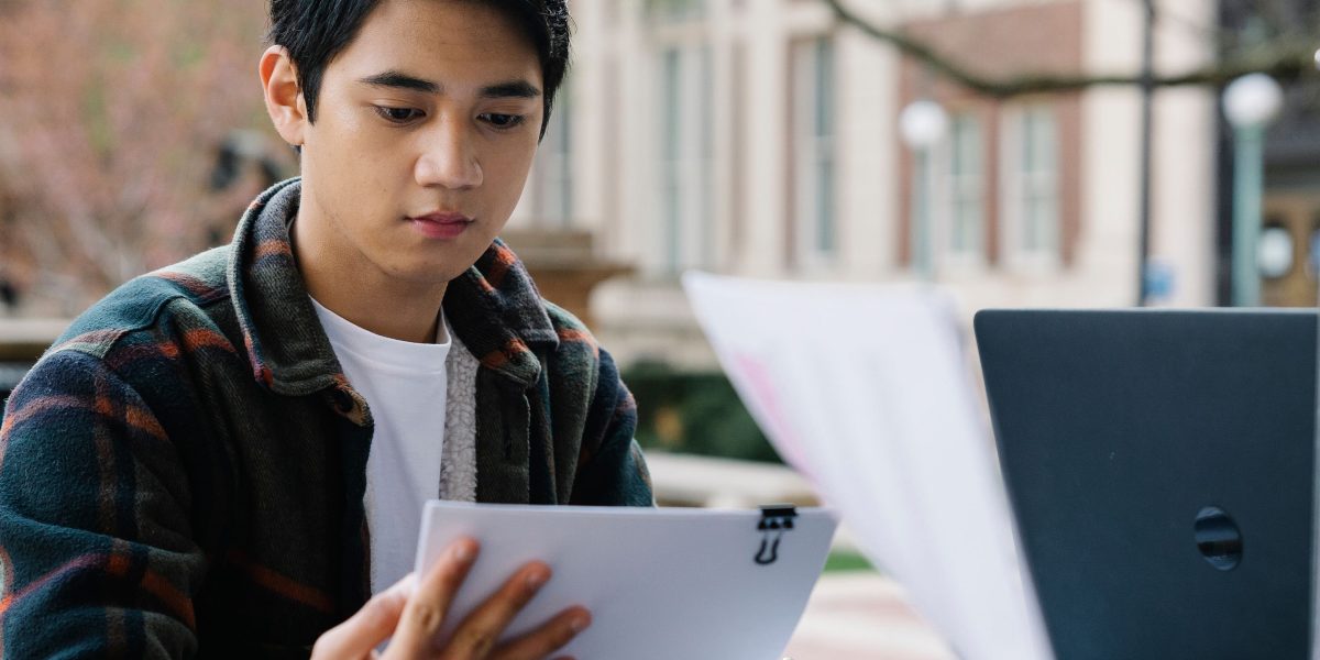 A student reviews information, pondering the accuracy of AI-generated study aids, a common challenge in modern education.