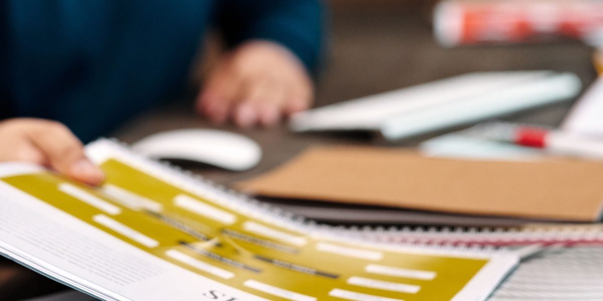 A researcher sifts through numerous academic papers, a process made more efficient with specialized AI tools.