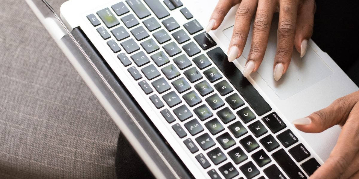 An individual reviewing various online job listings, highlighting the importance of searching broadly for data roles.