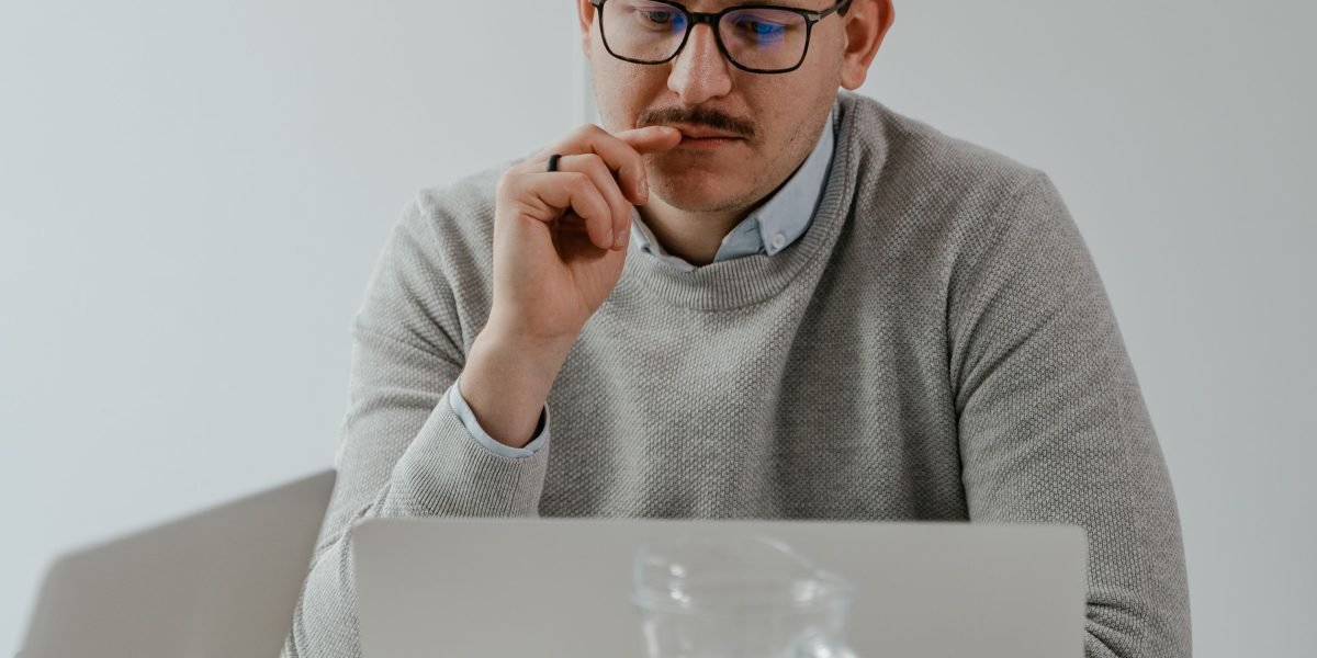 A developer pauses to critically evaluate code, reflecting on potential hidden flaws from AI generation.