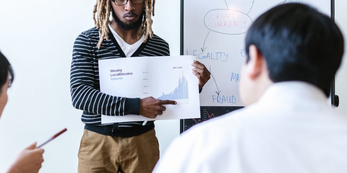 An individual confidently presents new research or innovative solutions for improving AI reliability.