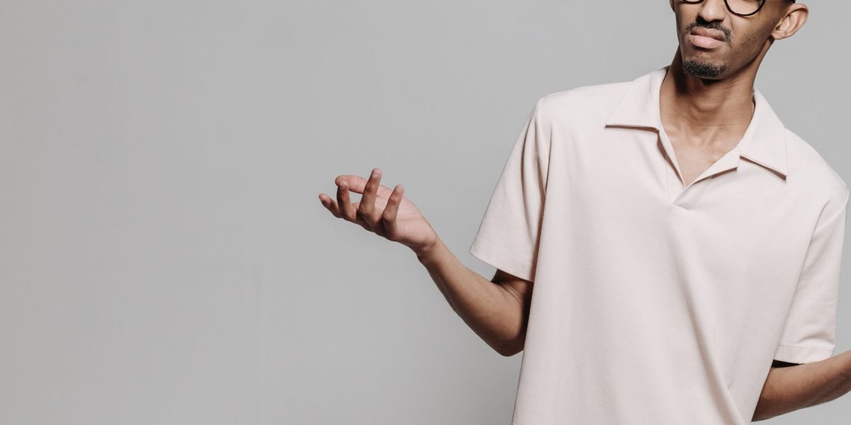A person looks thoughtfully, questioning information received from an AI assistant, reflecting the initial confusion caused by AI hallucinations.