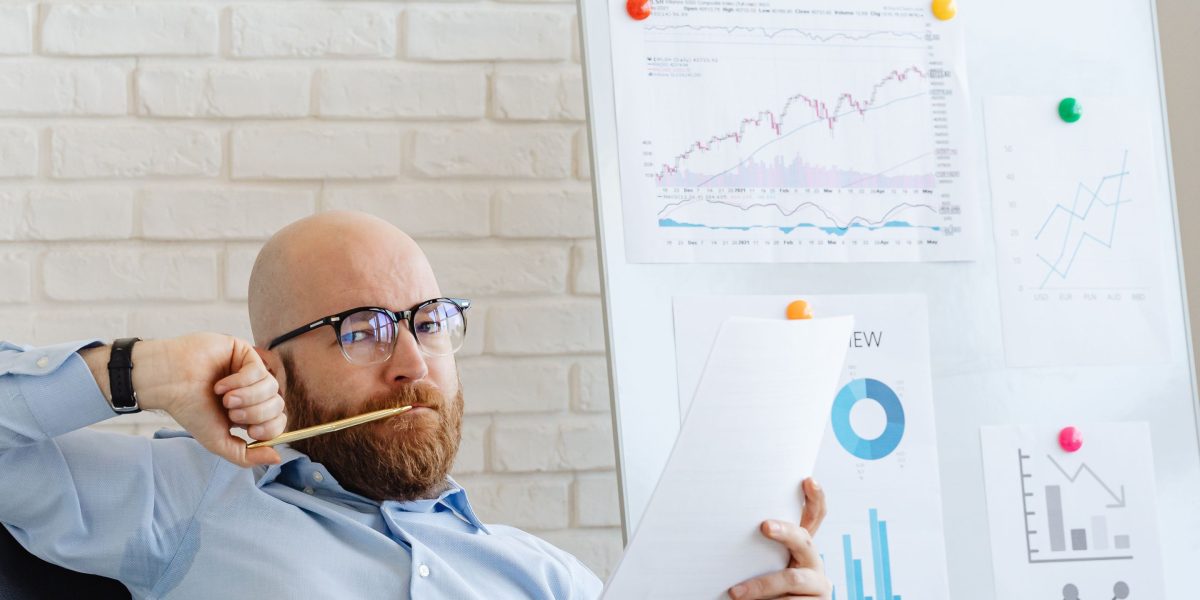 A business leader reviews an incorrect AI-generated forecast, highlighting the impact of AI hallucinations.