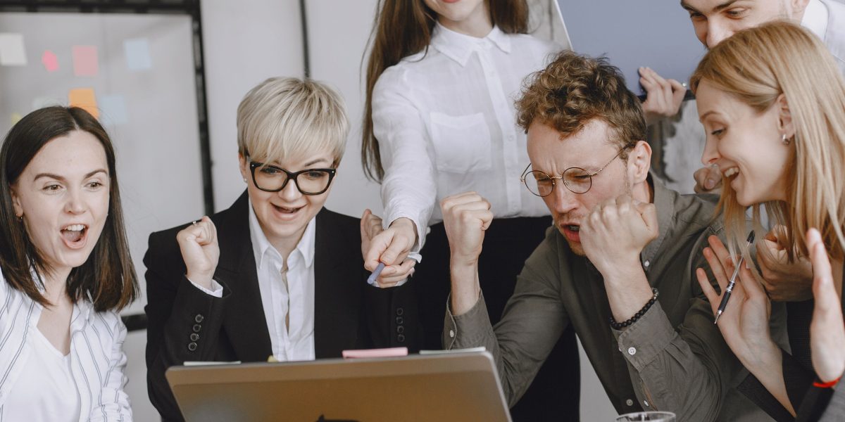 A team celebrates a significant achievement, symbolizing successful mitigation of AI hallucinations and improved trust.